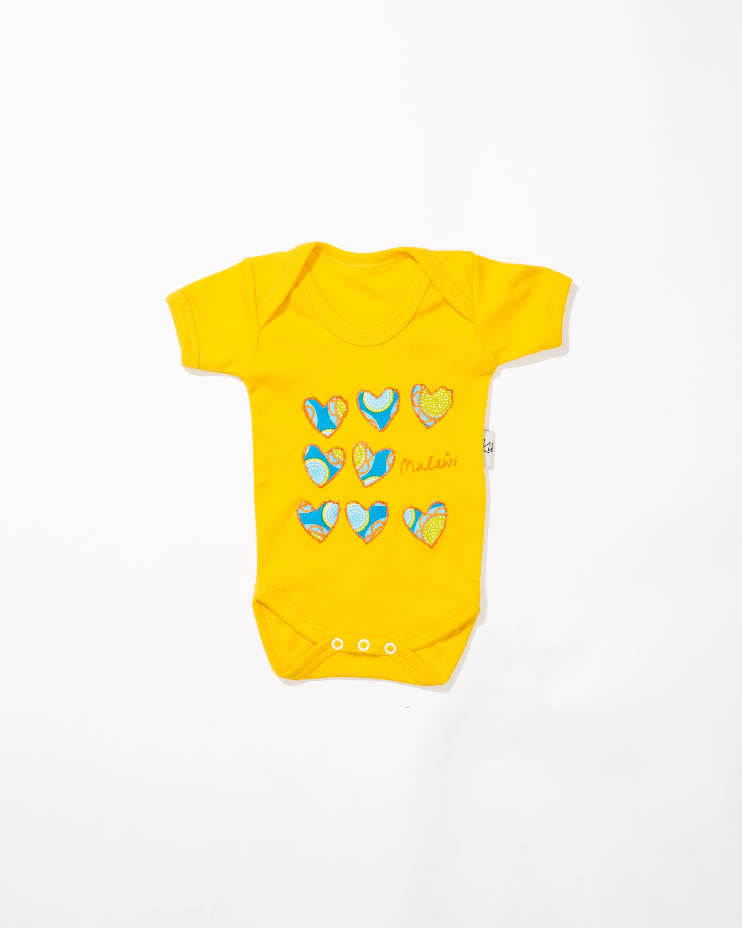 yellow short-sleeved baby onesie 